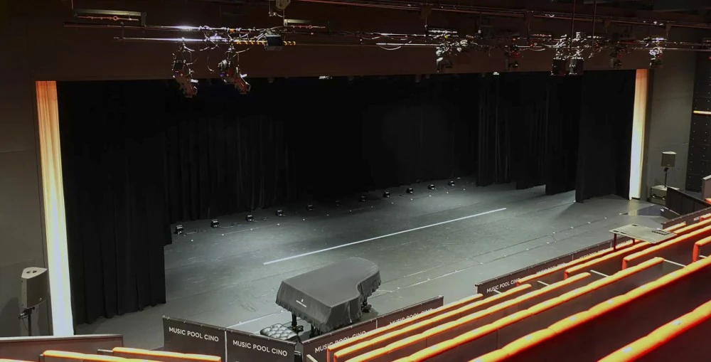 Senzoku Gakuen College of Music’s MUSIC POOL CINO LCR configuration of three L-Acoustics X12 flown across the front of the stage and one X12 mounted on SB18 per side for in-fill