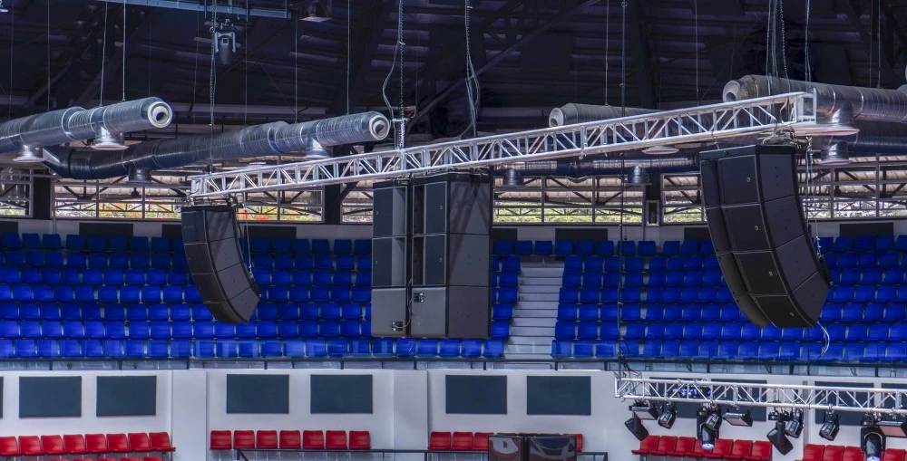 A dedicated FOH system comprising left/right hangs of three A15i Focus and one A15i Wide per side, alongside a centre cluster of six KS21i subwoofers is rigged on flown trusses that can be lowered during performances and retracted during sports programming