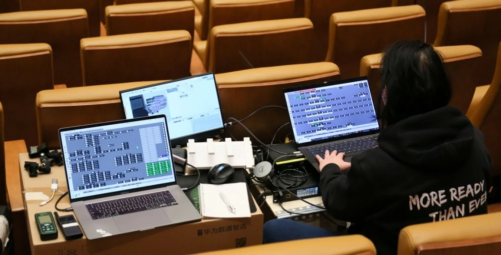The venue’s L-ISA spatial systems support a programming schedule that covers opera, chamber music, and contemporary performance
