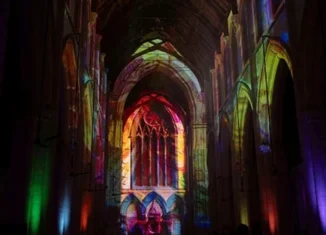 Truss-mounted projectors displayed Earth-to-cosmos visuals across the church’s soaring arches, vaulted ceilings and stained-glass windows